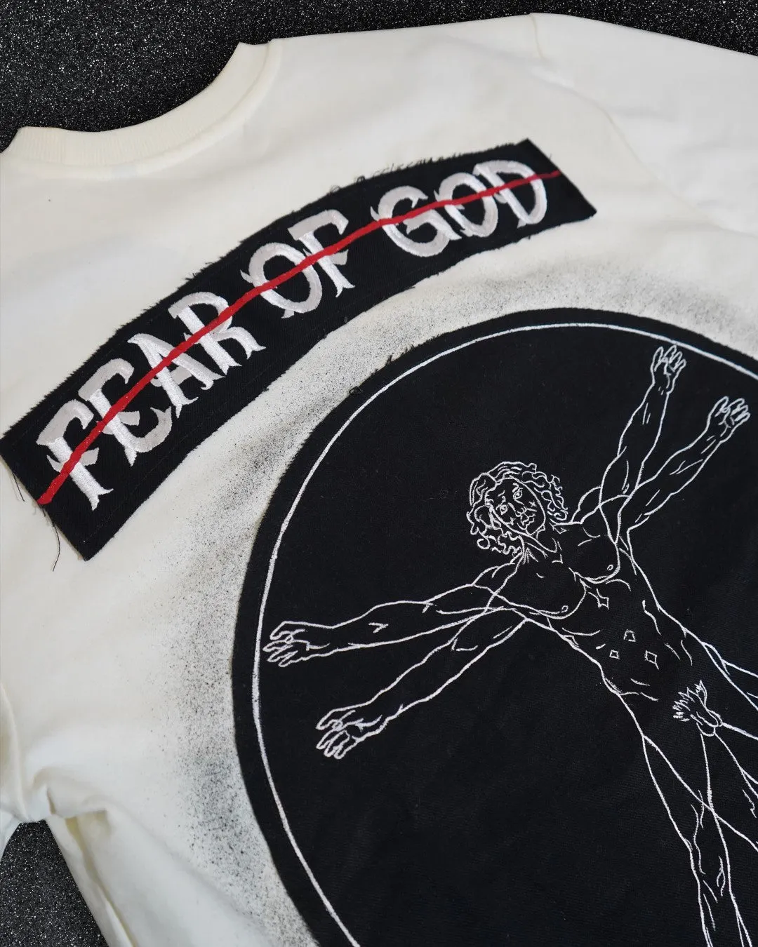 FEAR OF GOD vs VITRUVIAN MAN BLACK VALKYRE TSHIRT